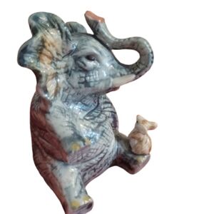 Ceramic elephant figurine. These types of figurines Luck home decor Irredescent